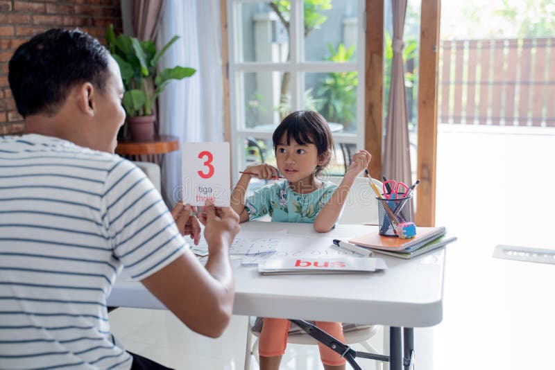Toddler learning simple math using flash card at home stock image Toddler learning simple math using flash card at home stock image