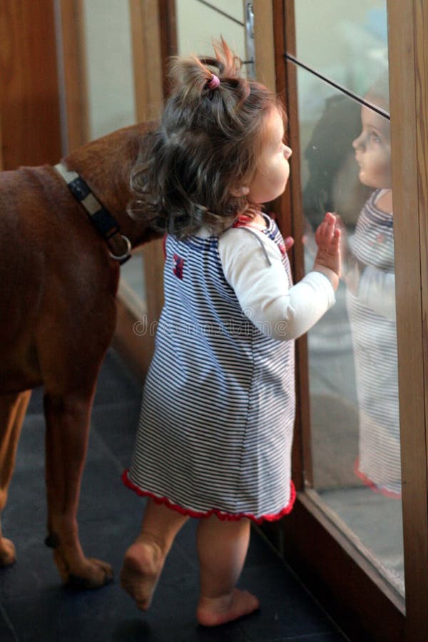 Toddler and pet dog