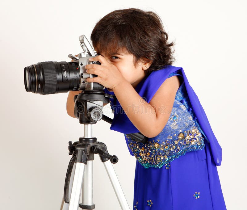 Toddler playing with camera