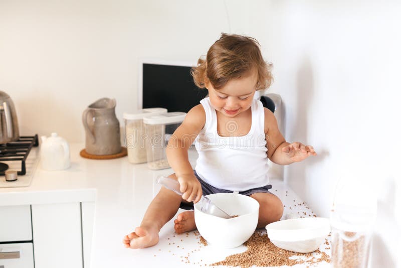 Toddler Playing at the Kitchen Stock Photo - Image of casual, desk: 77503310