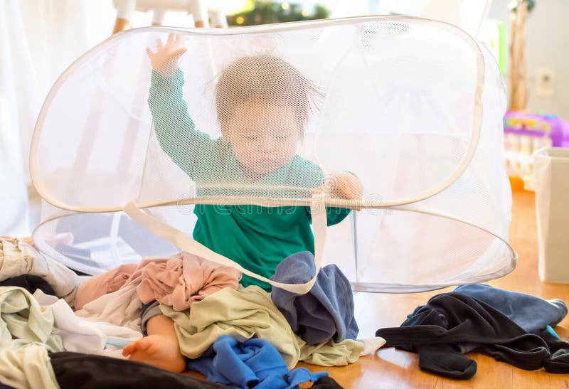 Toddler Playing with Laundry Stock Image Image of multiethnic