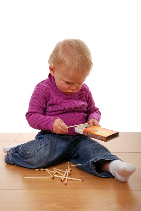 Toddler playing with matches