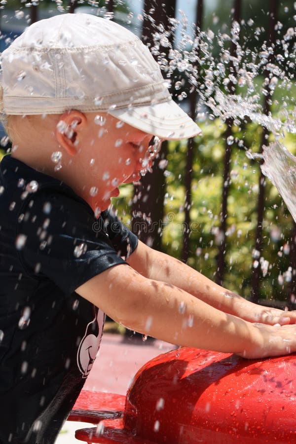 Toddler playing in some water