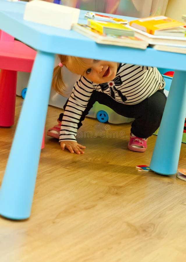 Toddler Playing Under Table Stock Image Image of playing, child 21440889