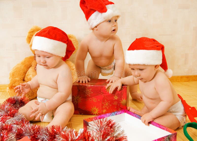 Toddlers in Christmas hats