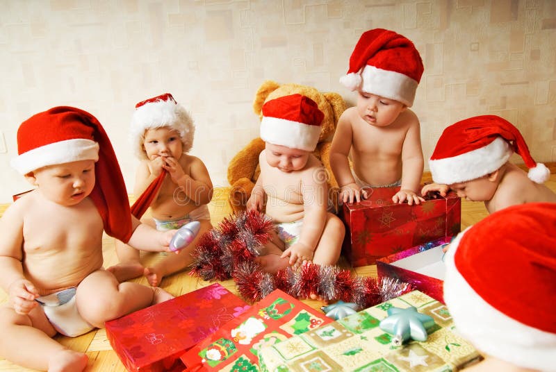 Toddlers in Christmas hats