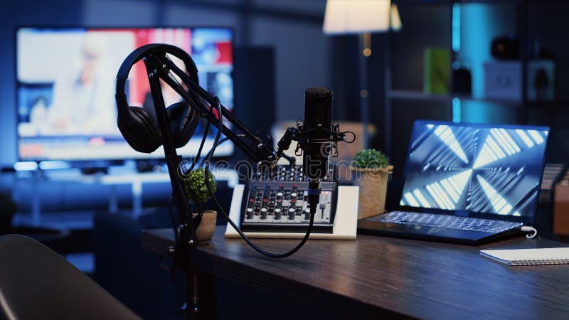 Panning shot of podcast microphone used to record discussions for internet livestreaming channel and 3D renders running on notebook screen. High tech streaming sound capturing and recording devices. Panning shot of podcast microphone used to record discussions for internet livestreaming channel and 3D renders running on notebook screen. High tech streaming sound capturing and recording devices