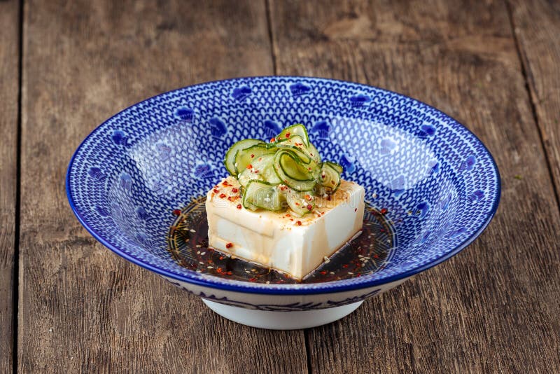 Tofu Dish in Japanese Style with Sauce, Seasoning and Cucumber Slices