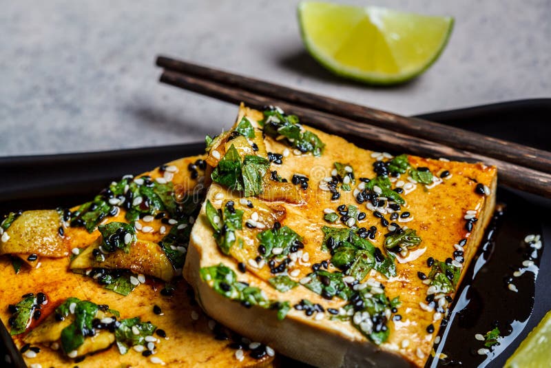 Tofu with Marinade of Soy Sauce, Ginger, Spices and Sesame Seeds in