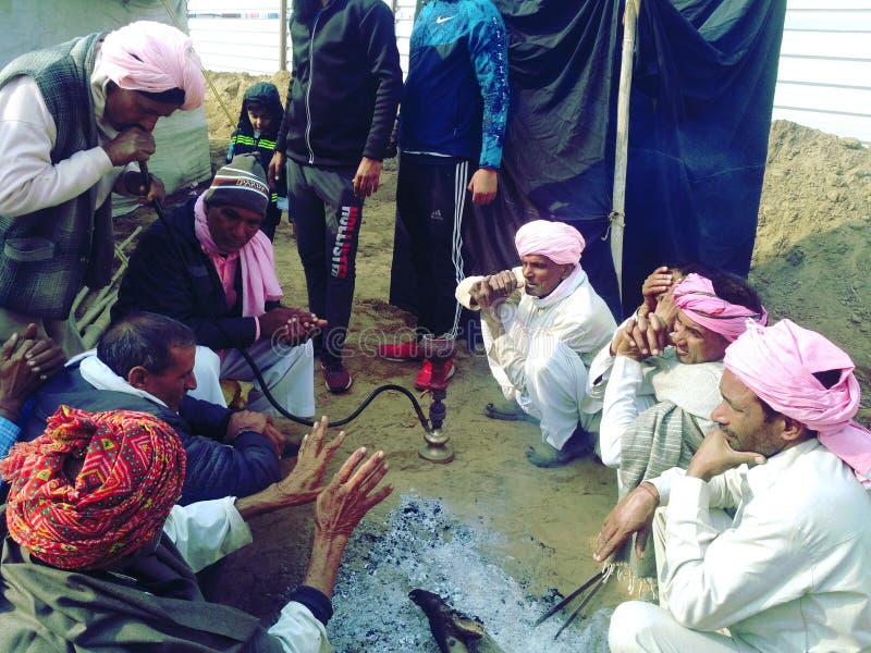 Indian smoking peace pipe stock photo. Image of warrior 21898144