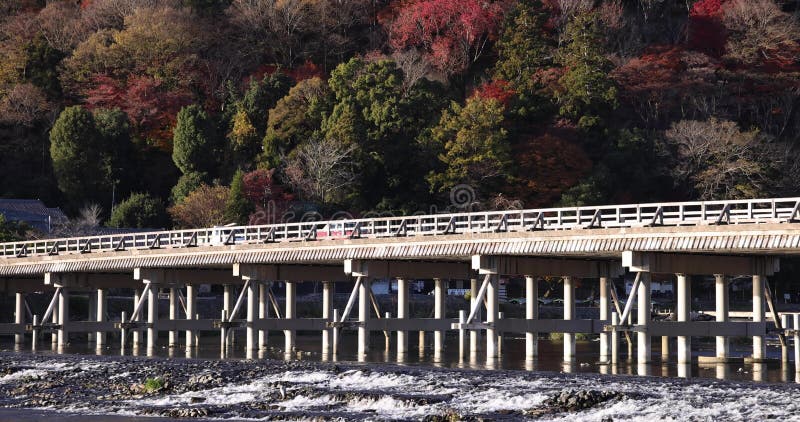 Togetsukyo bridge near Katsuragawa river in Kyoto in autumn telephoto shot