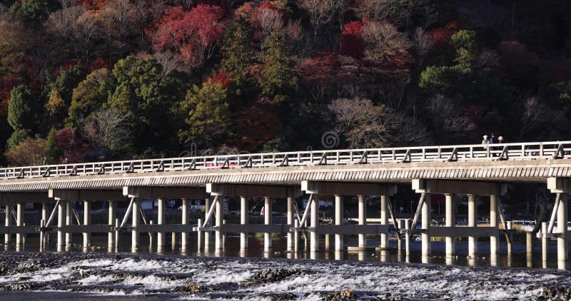 Togetsukyo bridge near Katsuragawa river in Kyoto in autumn telephoto shot