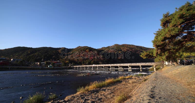 Togetsukyo bridge near Katsuragawa river in Kyoto in autumn wide shot