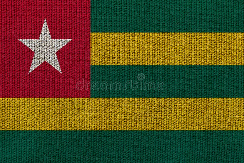 Togo National Flag Waving in the Wind Against Deep Blue Sky. International  Relations Concept Stock Illustration - Illustration of banner, flag:  212574617