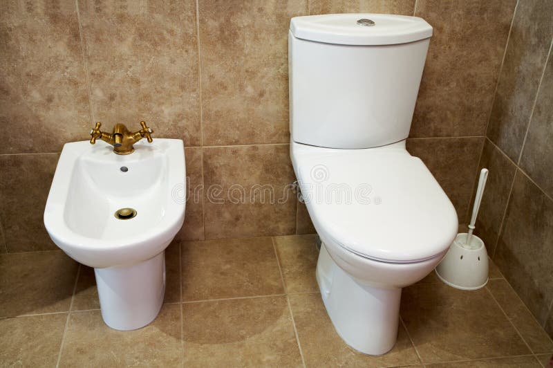 Toilet bowl and bidet stock photo. Image of light, floor 2812362
