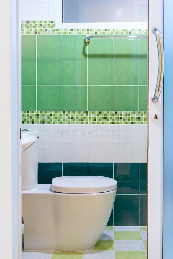 Toilet with green tile view