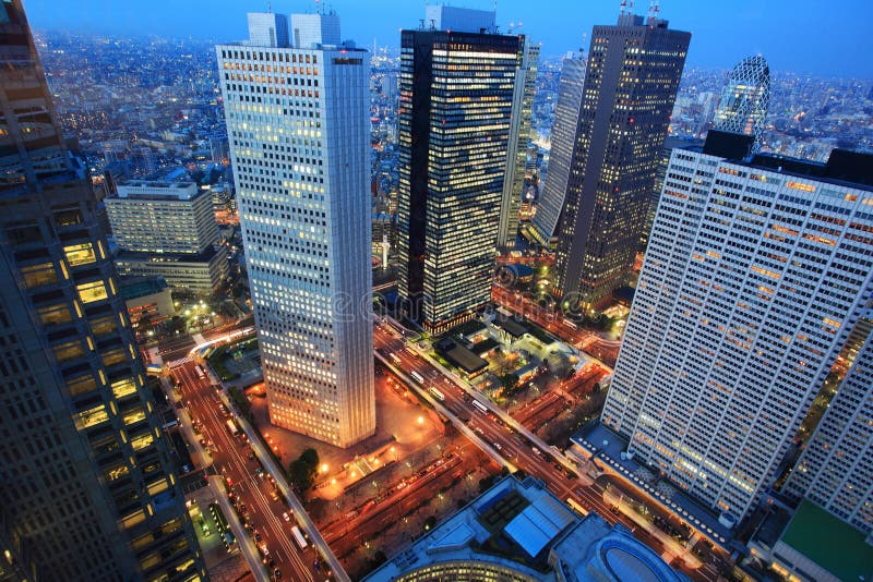 Birds eye view from observatories on the 45th floor of Tokyo Metropolitan Government Building at night, Japan. Tokyo Metropolitan Government Building is one of the Tokyo landmarks, located at Shinjuku ward, also referred to as Tokyo City Hall or Tacho for short. The 243 meter tall twin towers and surrounding buildings contain the offices and the assembly hall of the metropolitan government of Tokyo, as well as observatories on the 45th floor of each tower. Birds eye view from observatories on the 45th floor of Tokyo Metropolitan Government Building at night, Japan. Tokyo Metropolitan Government Building is one of the Tokyo landmarks, located at Shinjuku ward, also referred to as Tokyo City Hall or Tacho for short. The 243 meter tall twin towers and surrounding buildings contain the offices and the assembly hall of the metropolitan government of Tokyo, as well as observatories on the 45th floor of each tower.