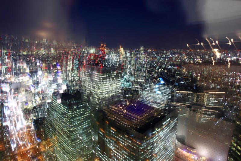 Bird's eye view from observatories on the 45th floor of Tokyo Metropolitan Government Building at night, Japan. Tokyo is one of the three world finance command centers, along with New York City and London. Tokyo has the largest metropolitan economy in the world. It makes success and confusing and here is full of lust, lost and dreams. Bird's eye view from observatories on the 45th floor of Tokyo Metropolitan Government Building at night, Japan. Tokyo is one of the three world finance command centers, along with New York City and London. Tokyo has the largest metropolitan economy in the world. It makes success and confusing and here is full of lust, lost and dreams.