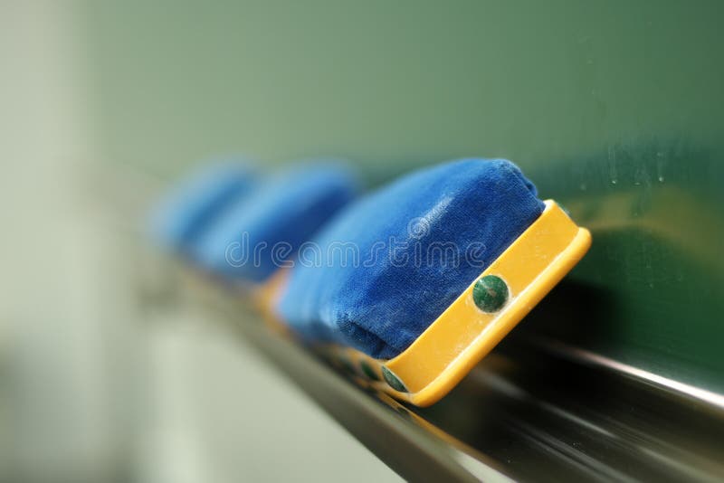 Three Erasers and a Blackboard in a Classroom Stock Photo Image of