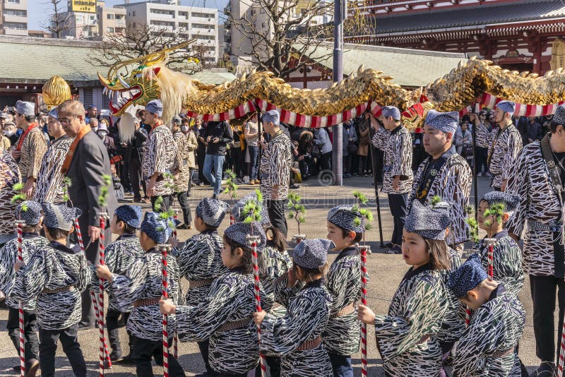 Japanese children in kimono walking during the golden dragon dance  festival of Sensoji temple in Asakusa.