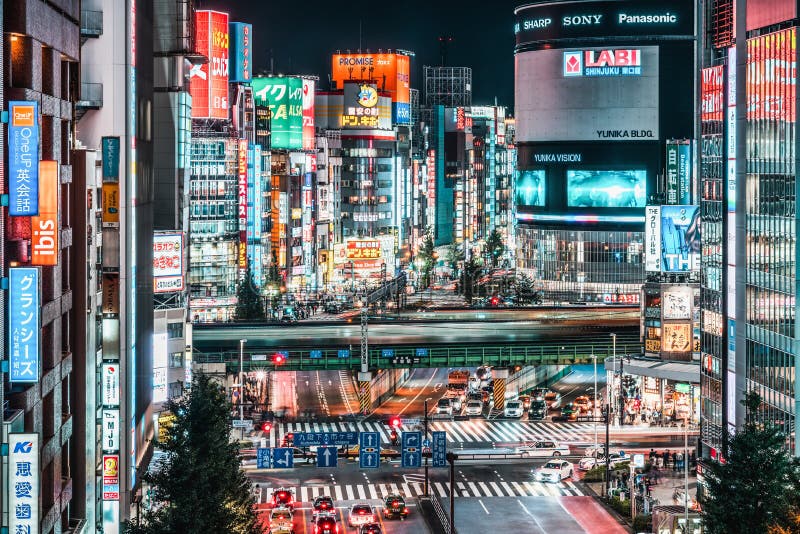 Tokyo, Japan - Nov 1, 2019: Car traffic, train transportation at Kabukicho district in Shinjuku, Tokyo night cityscape stock photography Tokyo, Japan - Nov 1, 2019: Car traffic, train transportation at Kabukicho district in Shinjuku, Tokyo night cityscape stock photography