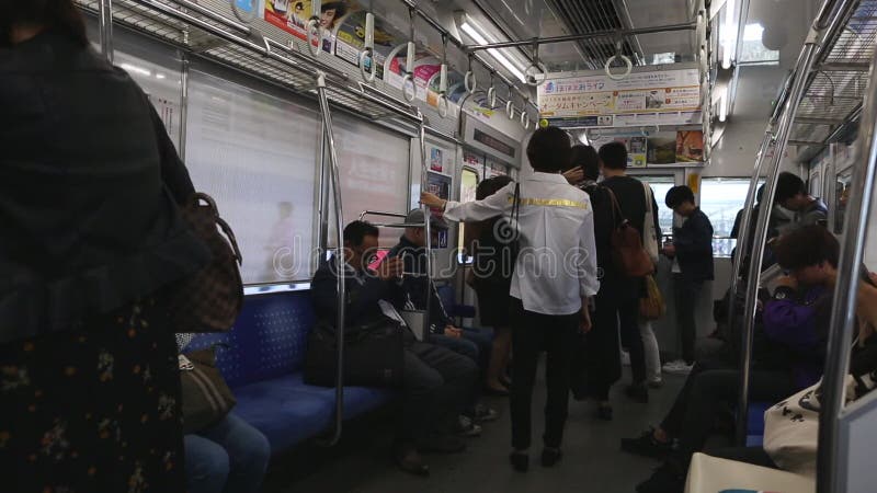 Tokyo Metro Full Underground Metro Train During Rush Hour In Tokyo Metro Passengers Look Into