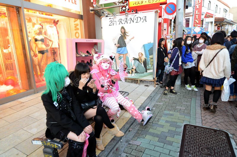 TOKYO - NOV 24 2013: Japanese girls in cosplay outfit gather around Harajuku train station in Tokyo stock photo TOKYO - NOV 24 2013: Japanese girls in cosplay outfit gather around Harajuku train station in Tokyo stock photo