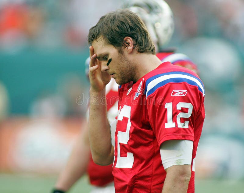 Dejected New England Patriots quarterback Tom Brady leaves the field after throwing his second interception against the Miami Dolphins at Landshark stadium in Miami on December 6, 2009. Dejected New England Patriots quarterback Tom Brady leaves the field after throwing his second interception against the Miami Dolphins at Landshark stadium in Miami on December 6, 2009.