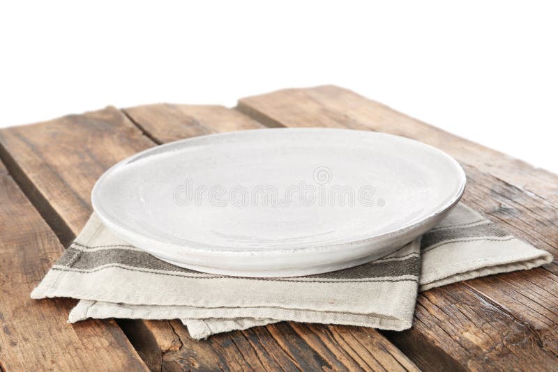 Tom platta och napkin på träbord mot bakgrund royaltyfria bilder