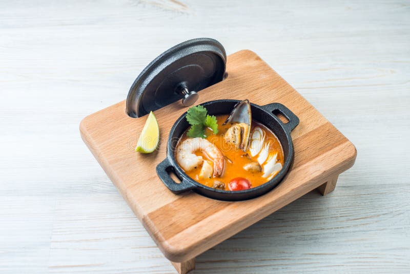 Tom yam kong on wooden table. Thai food royalty free stock photo Tom yam kong on wooden table. Thai food royalty free stock photo