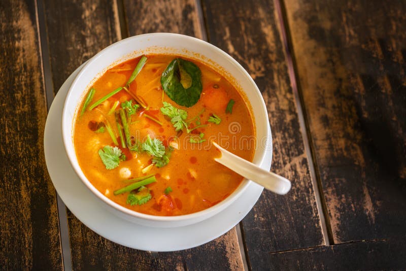 Tom Yam Kung, Thai cuisine. on a wooden table, top view royalty free stock image Tom Yam Kung, Thai cuisine. on a wooden table, top view royalty free stock image