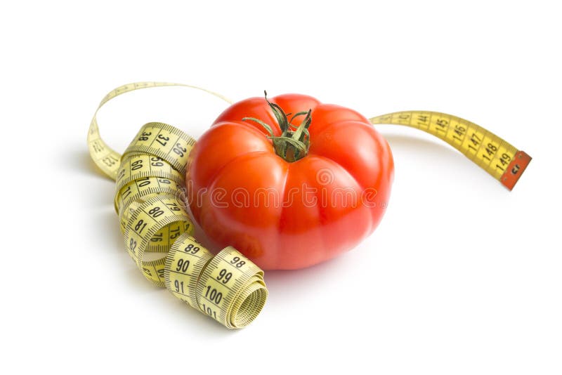 Tomate vermelho e fita de medição fotografia de stock Tomate vermelho e fita de medição fotografia de stock
