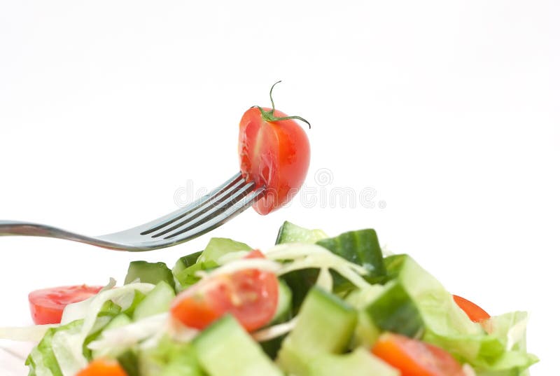Tomato cherry on fork. Diet