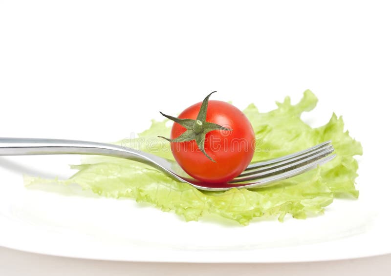 Tomato cherry on fork. Diet