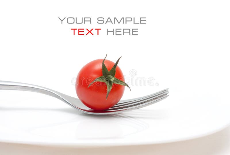 Tomato cherry on a fork. Diet and healthy meals