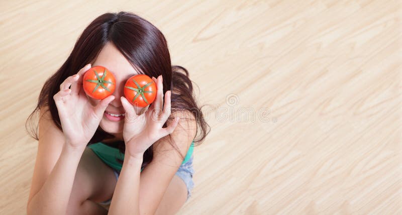 Tomato. funny girl showing tomatos