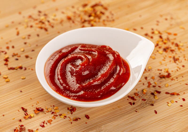 Tomato ketchup in a small bowl royalty free stock image