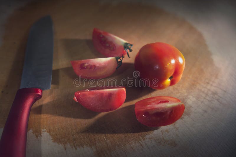 Tomato in Kitchen stock image. Image of tomato, knife 83547147