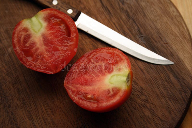 Tomato With Knife Picture. Image 6388769