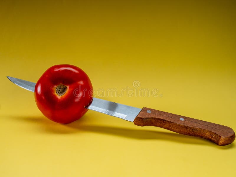 Tomato with Knife on Yellow Background Stock Photo Image of high