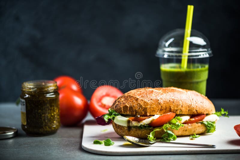 tomato, mozarella and pesto . sandwich