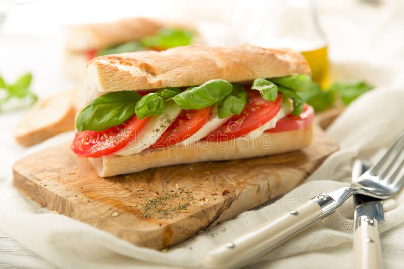 Tomato mozzarella baguette stock photo. Image of olive - 51109310