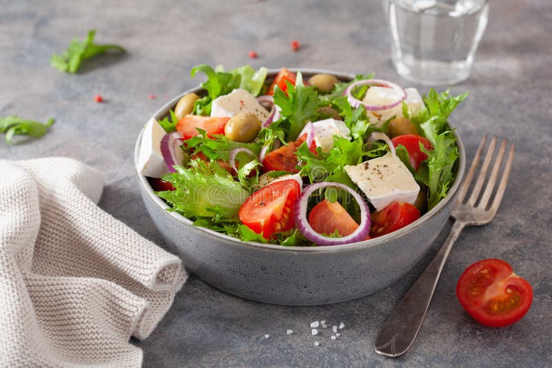 Tomato Salad with Brie Cheese Olives Onion Lettuce Stock Photo Image
