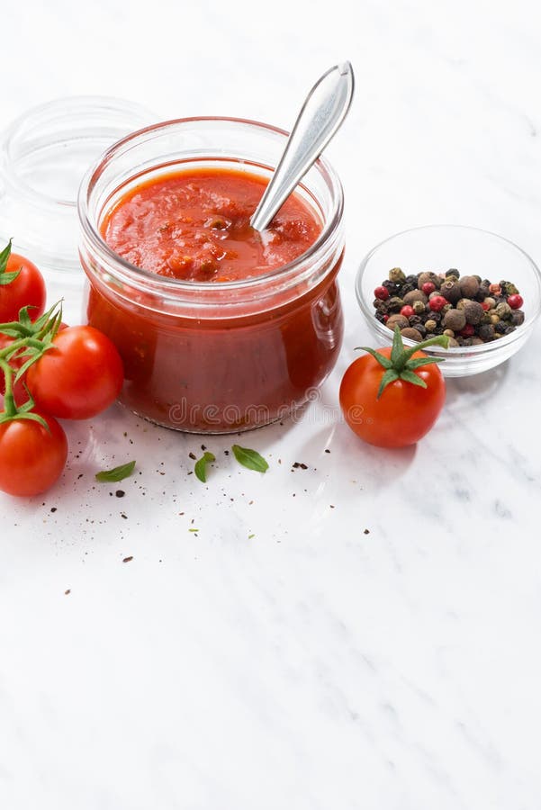 Tomato Sauce In A Glass Jar On White Background, Vertical Stock Image
