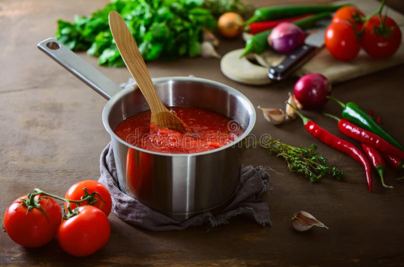 Tomato sauce in a pan on a kitchen table