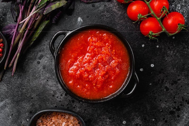 Tomato Sauce in Small Bowl, on Black Dark Stone Table Background, Top