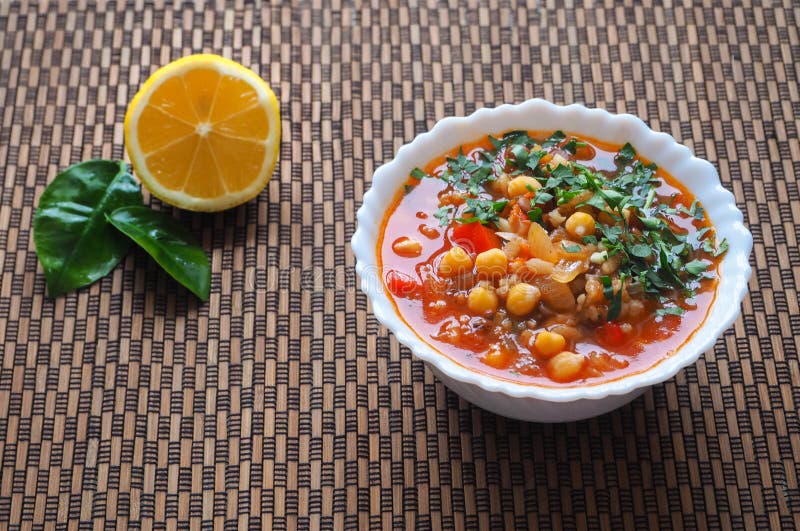 Tomato soup with chickpeas and vegetables. Arabic cuisine. Fast food in Ramadan.