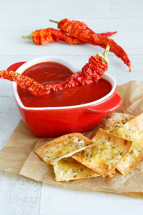 Tomato soup with chili and cheese crisps