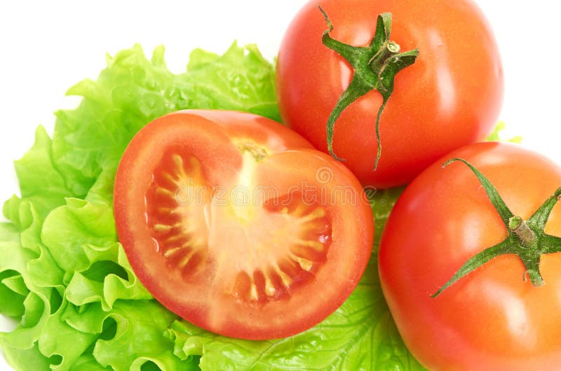 Sliced tomatoes on lettuce stock image. Image of cook 3143123