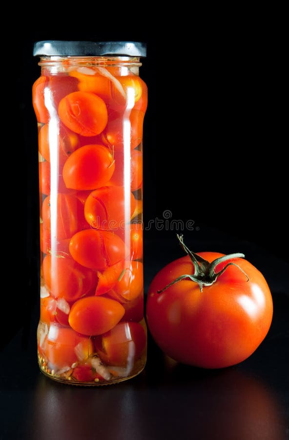 Canned Tomatoes in Glass Jars .still Life on a Black Background Stock ...
